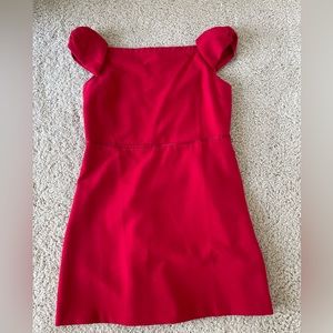Red off shoulder dress. Bow on sleeve